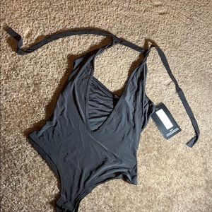 Plunging neckline black bodysuit